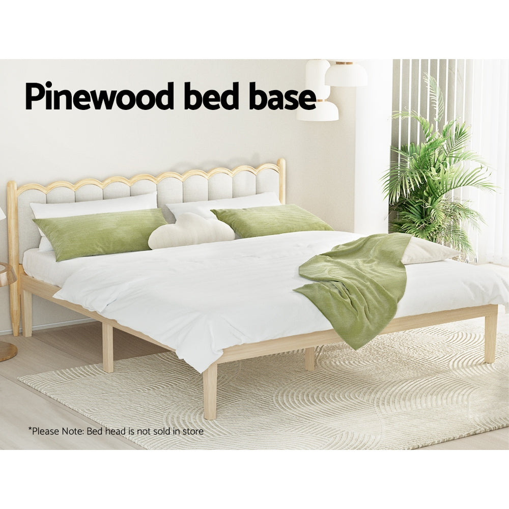 Bruno Minimalist King Solid Pinewood Bed Frame in natural wood finish with white bedding and green pillows in bright room