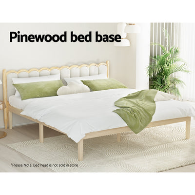 Bruno Minimalist King Solid Pinewood Bed Frame in natural wood finish with white bedding and green pillows in bright room