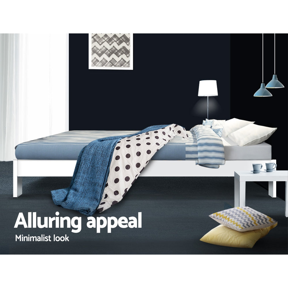 Fairy Wooden Queen Bed Frame White with minimalist design shown with bedding, pillows, side table, lamp, and wall art