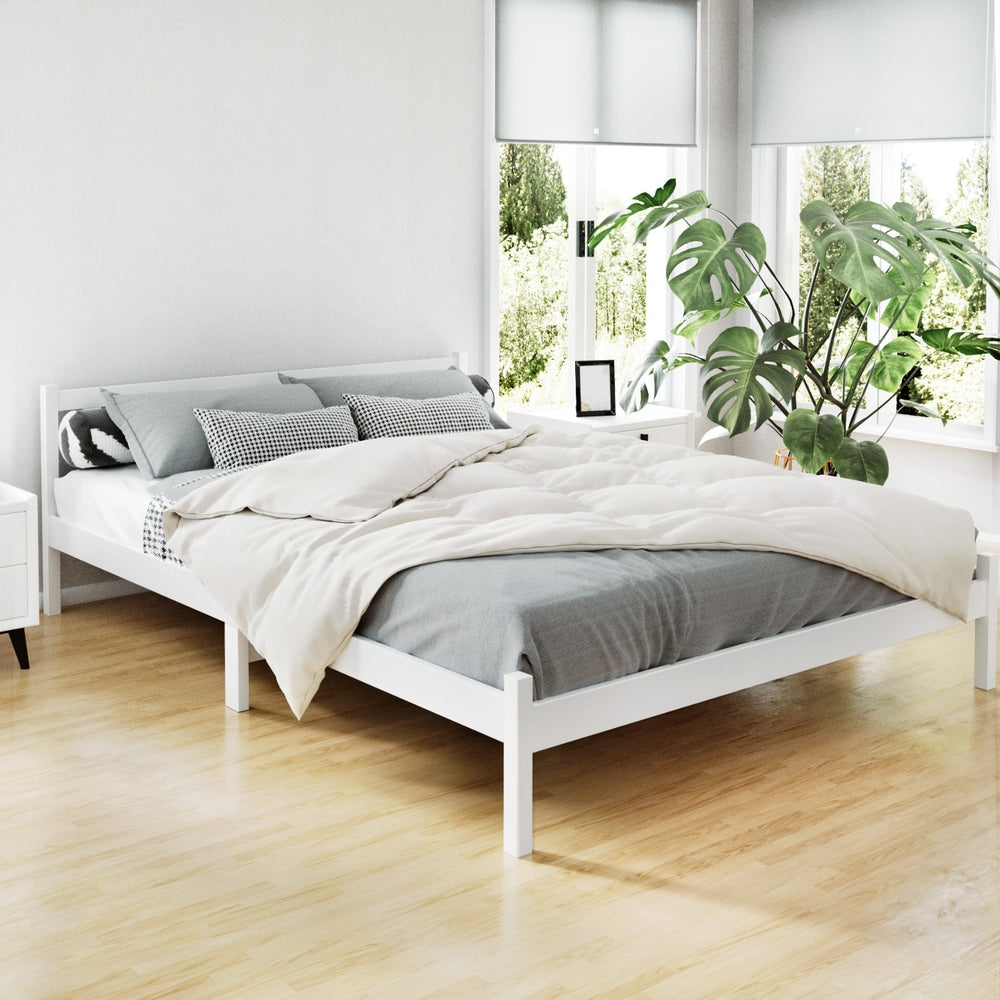 Whitehaven Wooden Queen Bed Frame White made of solid pine with simple design in bright bedroom setting