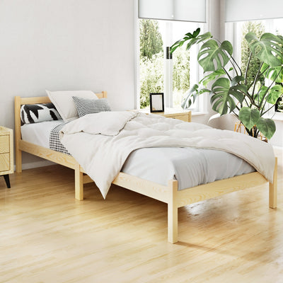 Bribie Wooden Single Bed Frame in natural finish with minimalist design, styled in bright bedroom with plants and bedding.