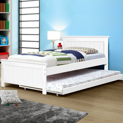Kids Elvis Wooden King Single Trundle Bed Frame White in a bright bedroom with bedding and a bedside lamp on wooden floor