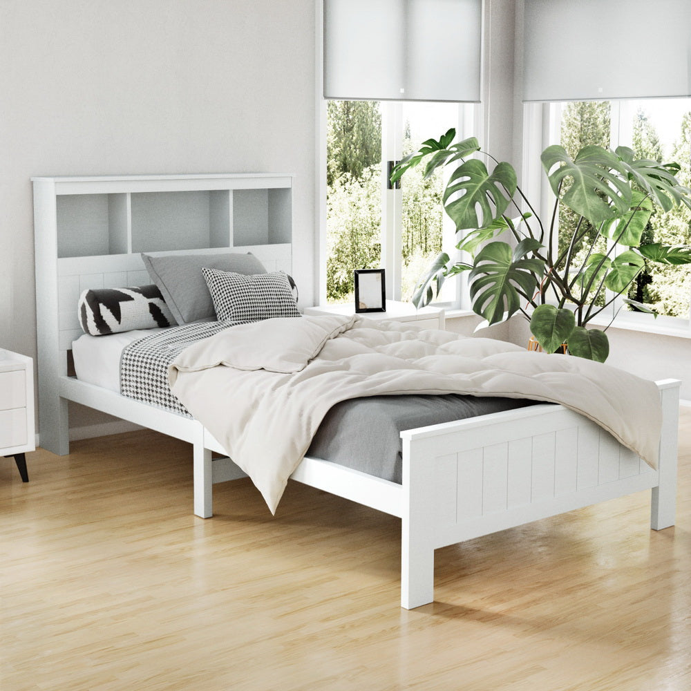 Kids Conqueror Wooden King Single Bed Frame with Shelving White in modern bedroom setting with wooden floor and plants