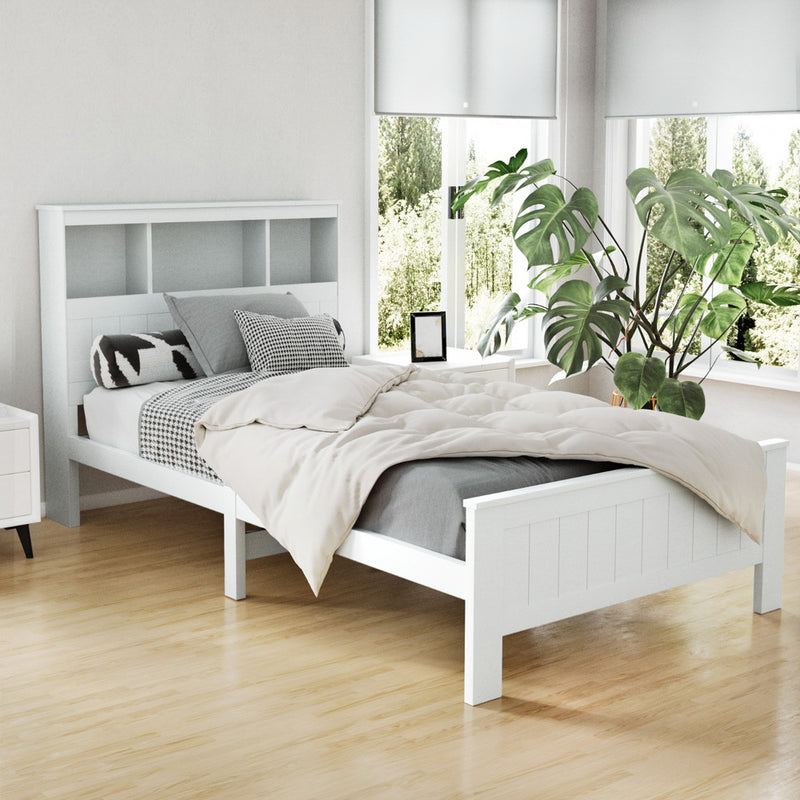 Kids Conqueror Wooden King Single Bed Frame with Shelving White in modern bedroom setting with wooden floor and plants