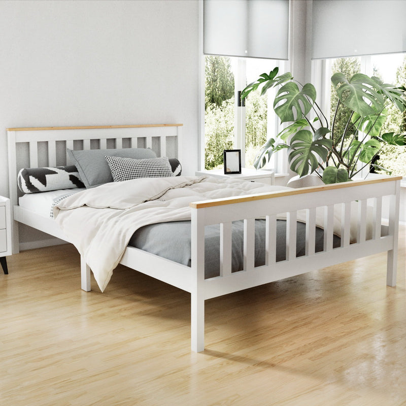 Kewarra Wooden Double Bed Frame White in bright bedroom with linens, pillows, wooden slats, and bedside table