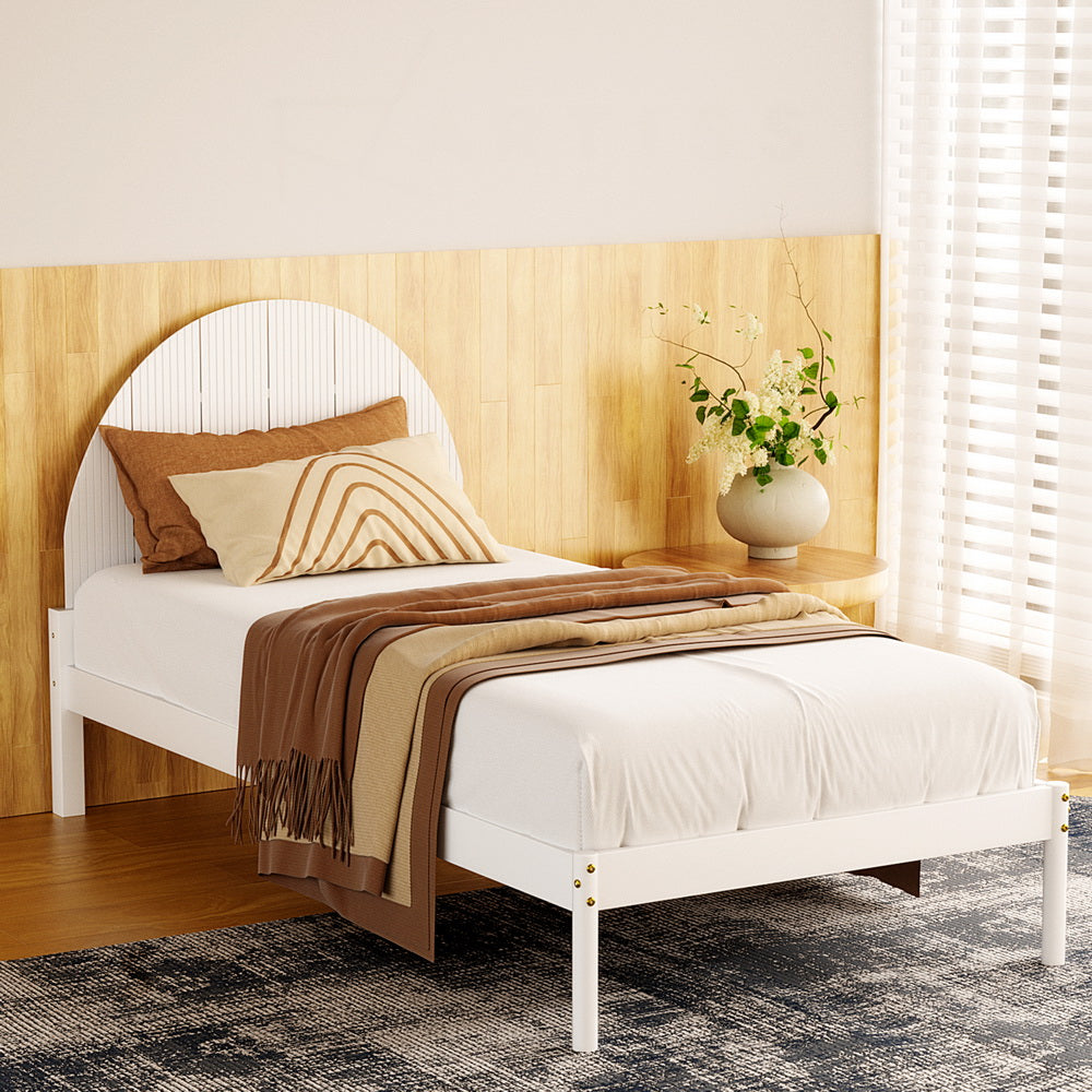 Daly Single Wooden Bed Frame White with semicircular headboard and white bedding in a modern bedroom setting