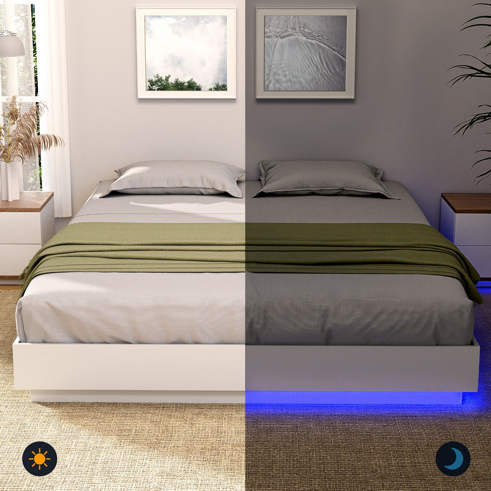 Dayglow Double LED Wooden Bed Frame – Pine with built-in blue LED lighting, shown with gray bedding and green throw blanket