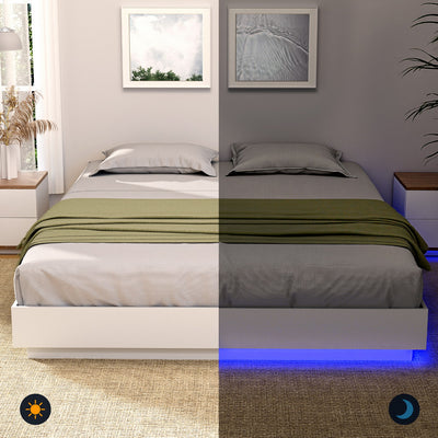 Dayglow Double LED Wooden Bed Frame – Pine with built-in blue LED lighting, shown with gray bedding and green throw blanket