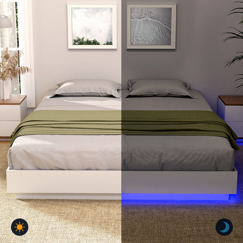 Dayglow Double LED Wooden Bed Frame – Pine with built-in blue LED lighting, shown with gray bedding and green throw blanket