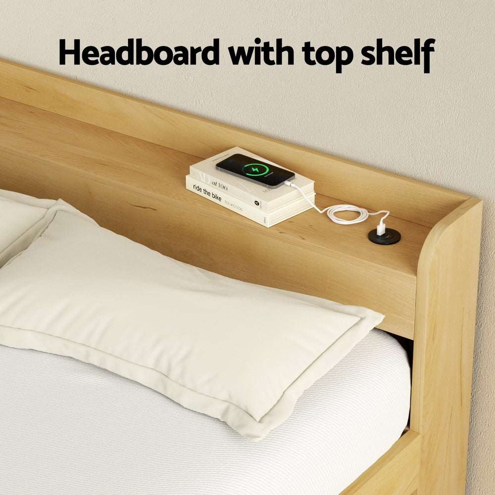 Aura Double Bed Frame With 2 Storage Drawers Wood showing wooden headboard with built-in top shelf holding books and phone charger