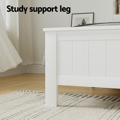 Close-up of the Flinders White Pine Storage Bed Frame with Storage Drawers – Double showing sturdy white pine support leg on wooden floor and rug.