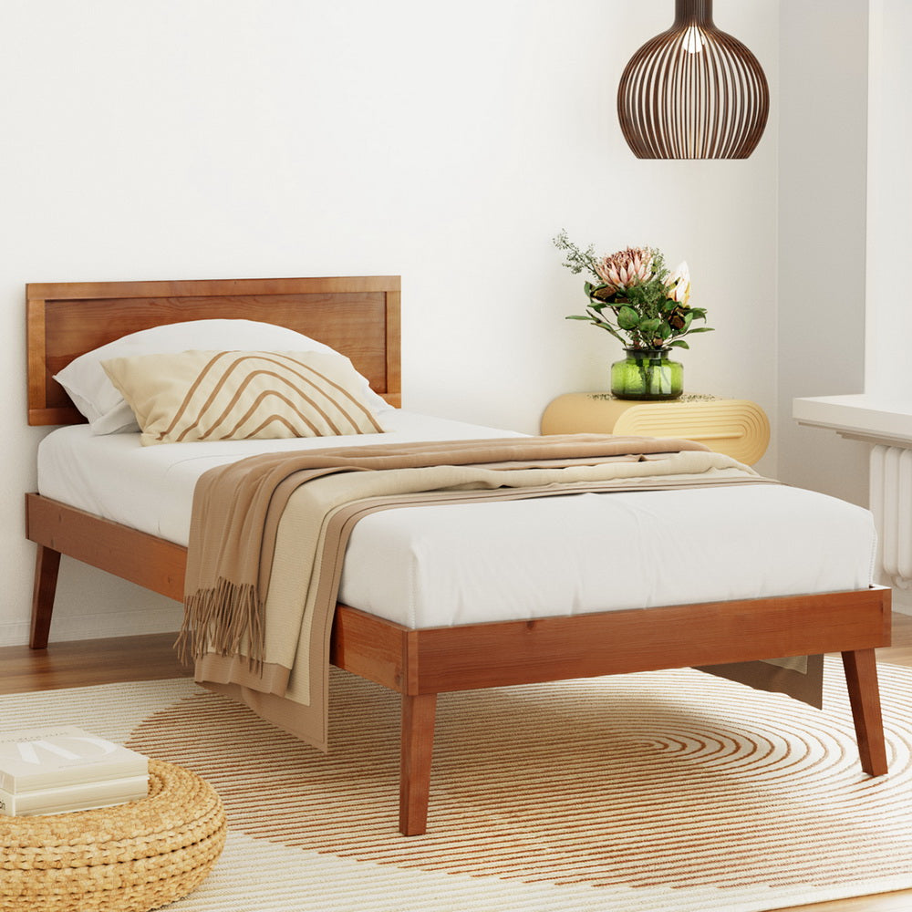Splay Single Wooden Bed Frame Walnut with simple pinewood design, beige bedding, and cozy bedroom setting with modern decor