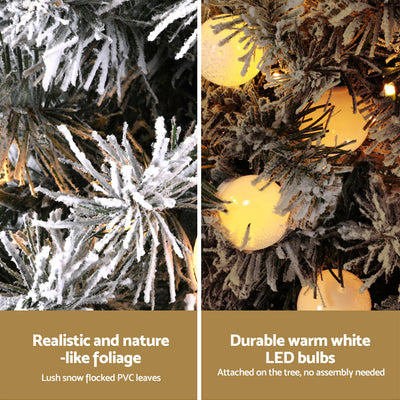 Close-up of Christmas Tree 1.2M Potted Snowy Xmas Tree showing realistic snowy foliage and warm white LED bulbs.