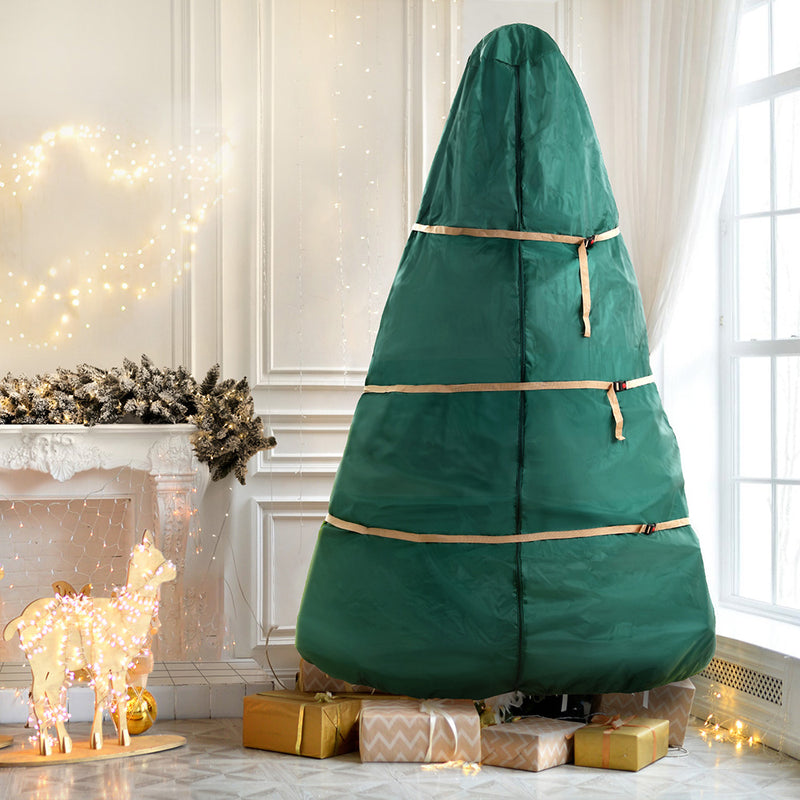 Christmas Tree Storage Bag Fits Up to 9ft Tree Xmas Bag Green with straps for secure storage in a decorated room setting