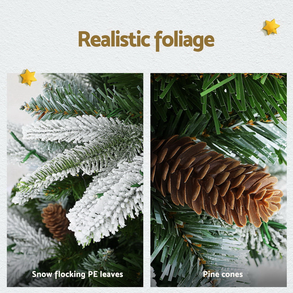 Close-up of snow flocked PE leaves and pine cones on the 6FT / 1.8M Christmas Tree – Snow Flocked with Pine Cones – 680 Tips – Pre-lit 280 Warm White LED Lights