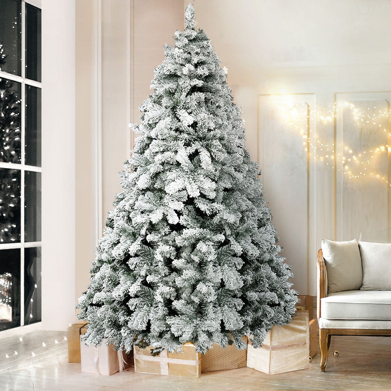 7FT / 2.1M Snow Flocked Christmas Tree – 859 Tips with dense snowy PVC branches in a stylish living room setting