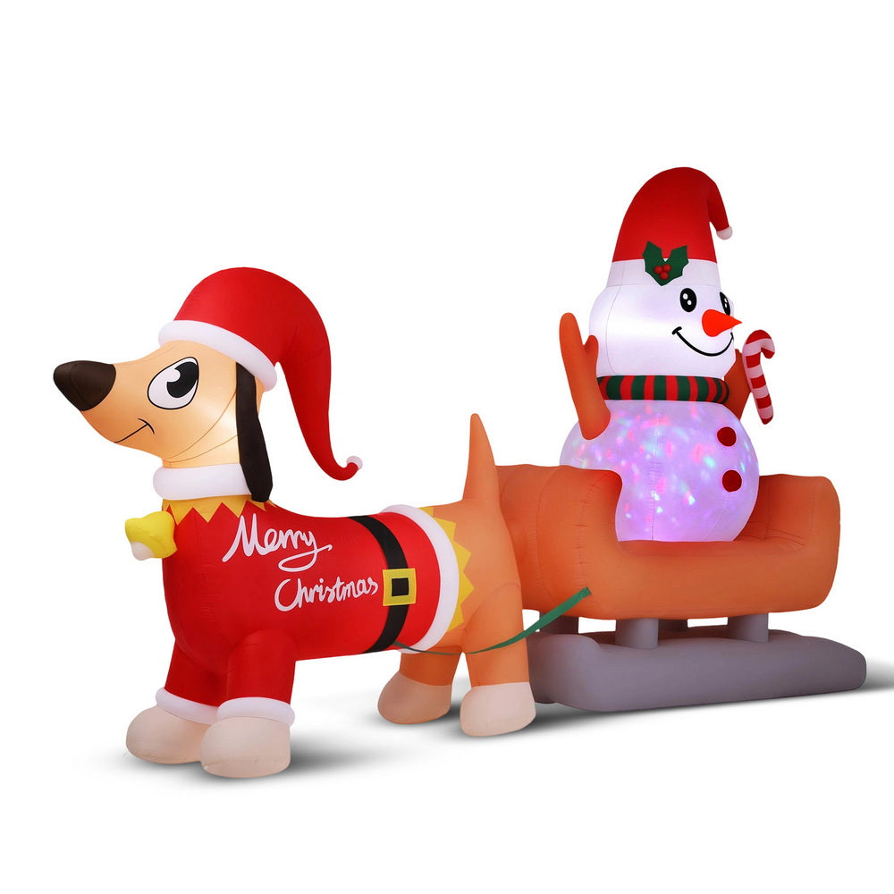 Christmas Inflatable Snowman Dog 4.2M Tall Outdoor Decorations Illuminated with LED lights showing festive dog and snowman on sled