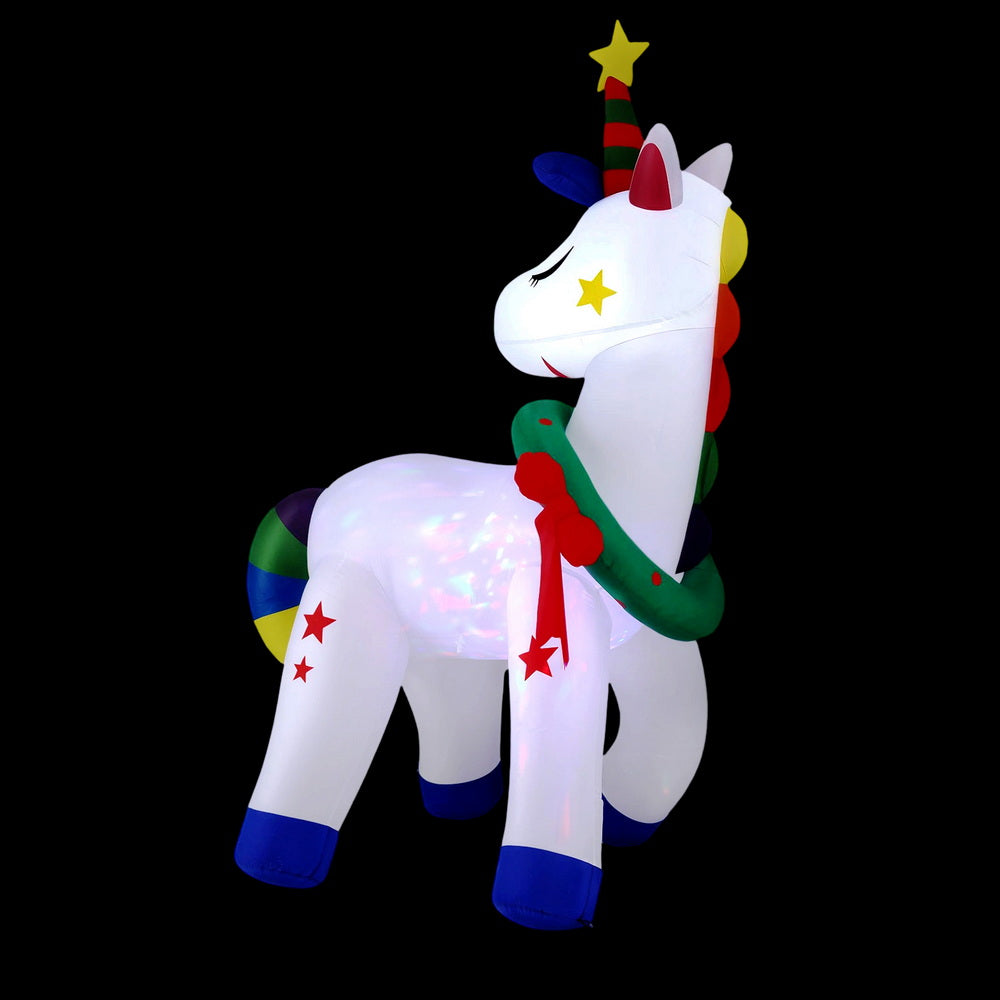 Christmas Inflatable Unicorn 1.8M Tall Outdoor Decorations Illuminated with colorful stars and festive wreath on black background