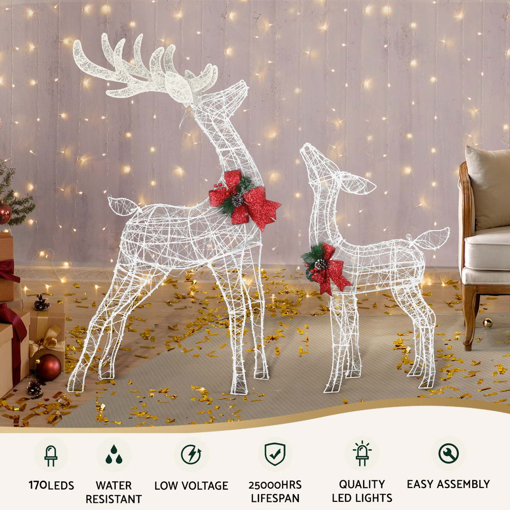 2 PCS Christmas Lights 170 LED Fairy Light Reindeer Decorations with red bows, set in a cozy room with warm string lights backdrop