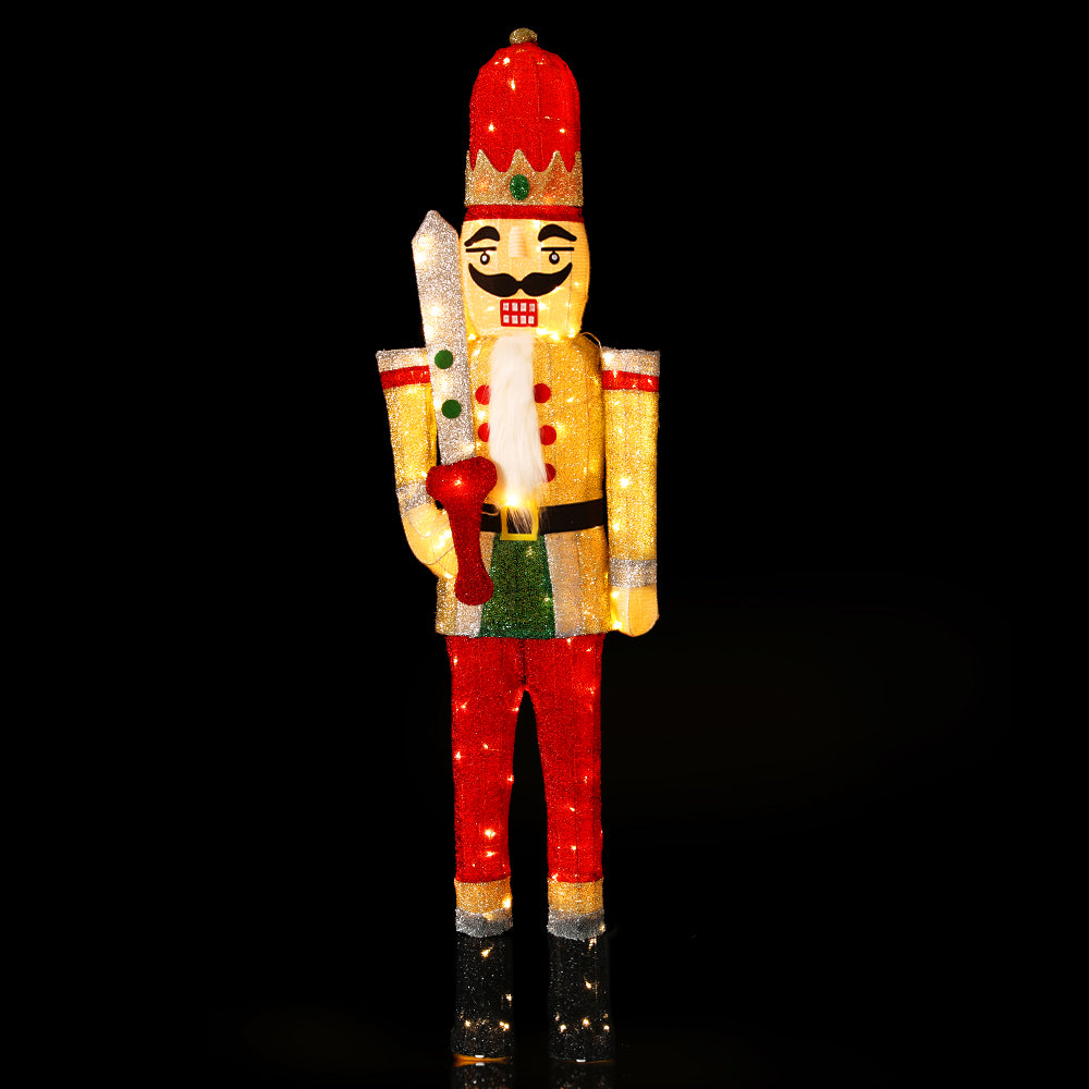 Christmas Lights 170cm Nutcracker 180 LED Fairy Light Decorations glowing figure in red, gold, and green on black background