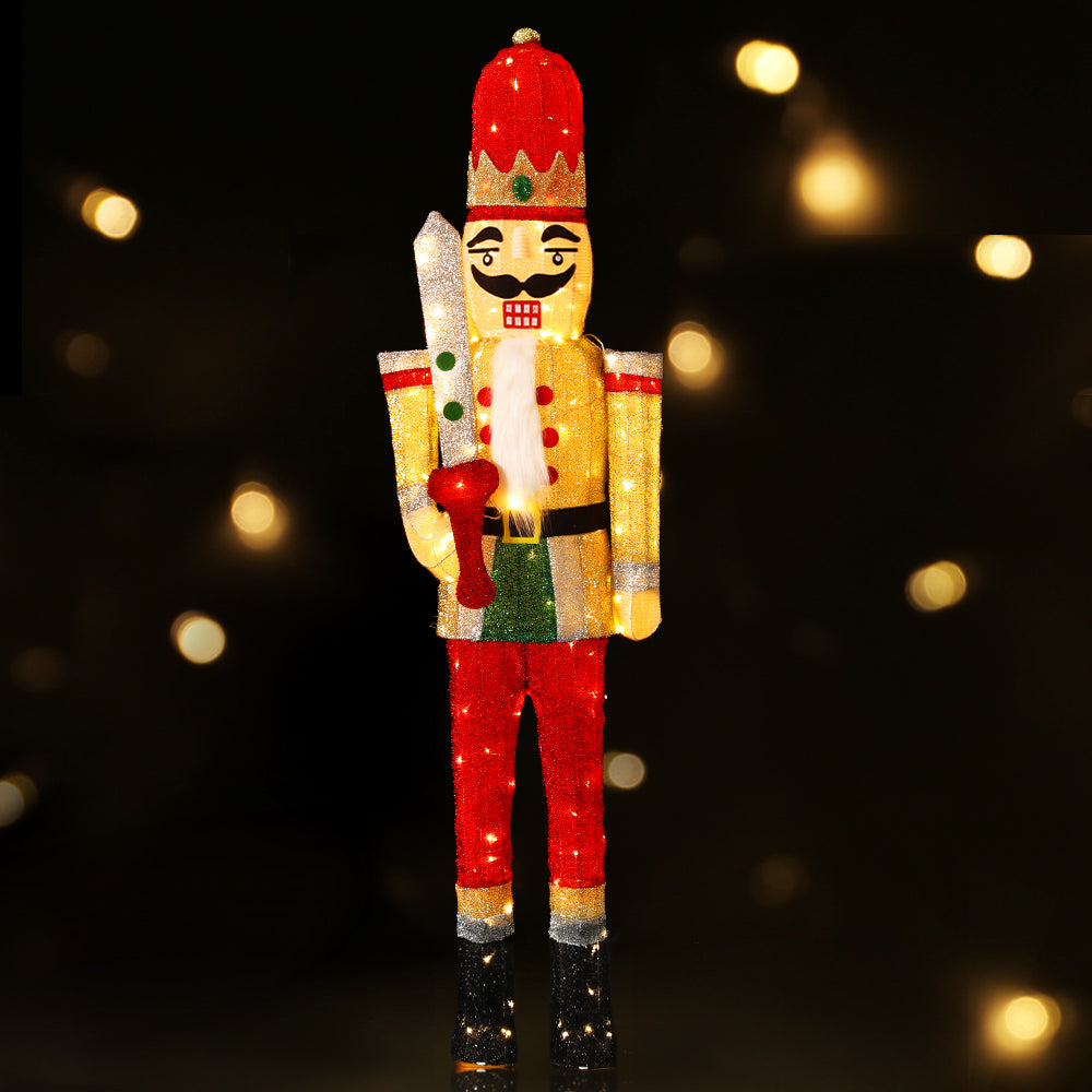 Christmas Lights 170cm Nutcracker 180 LED Fairy Light Decorations with red, gold, and green illuminated soldier figure on black background